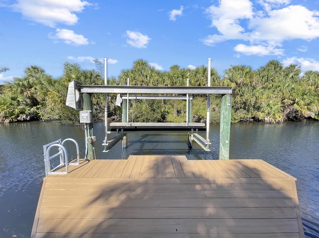 view of dock with a water view and boat lift