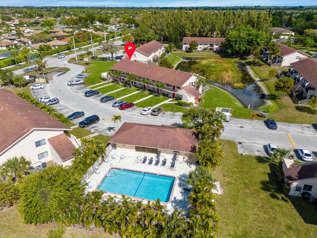 birds eye view of property with a residential view