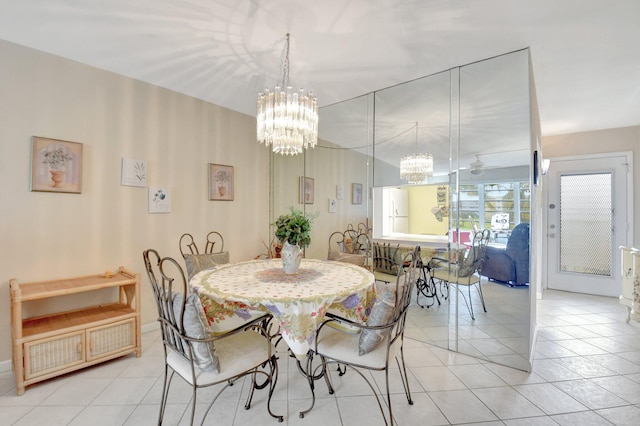 dining room featuring tile patterned flooring and an inviting chandelier