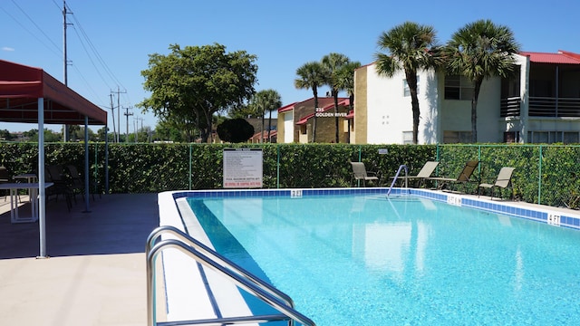 community pool featuring fence