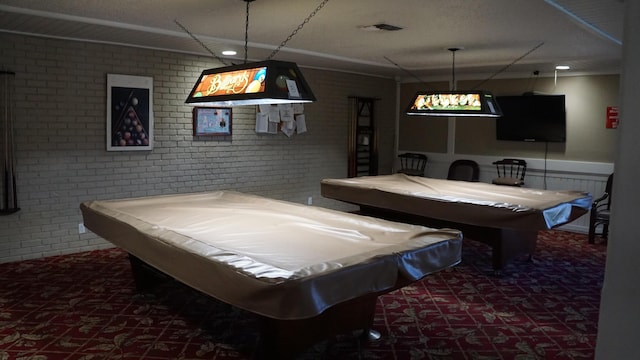 recreation room with carpet floors, brick wall, billiards, and visible vents