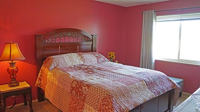 bedroom with carpet flooring and baseboards