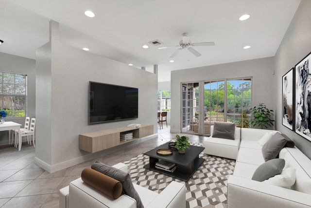 living area with recessed lighting, visible vents, baseboards, and light tile patterned flooring