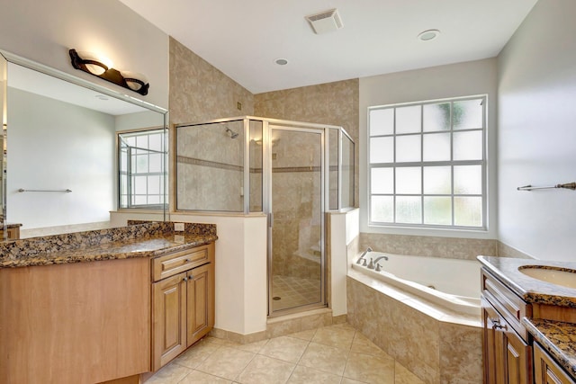 full bathroom featuring a stall shower, tile patterned flooring, visible vents, and a healthy amount of sunlight