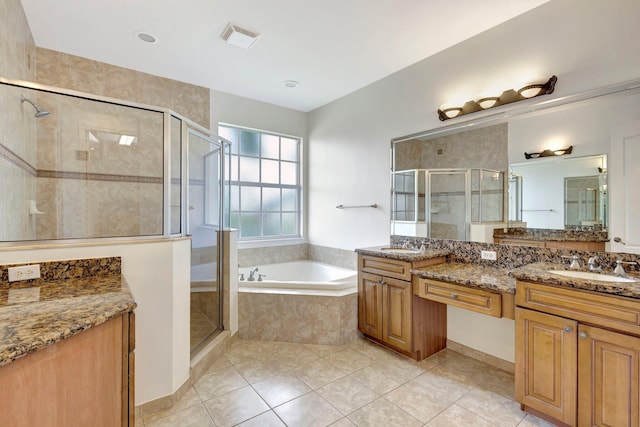 bathroom featuring a stall shower, visible vents, vanity, and a bath