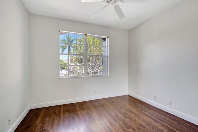 unfurnished room with a ceiling fan, baseboards, and wood finished floors