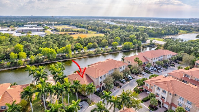 bird's eye view featuring a water view and a residential view