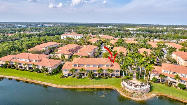 birds eye view of property with a residential view and a water view