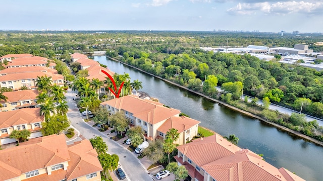 birds eye view of property featuring a residential view and a water view