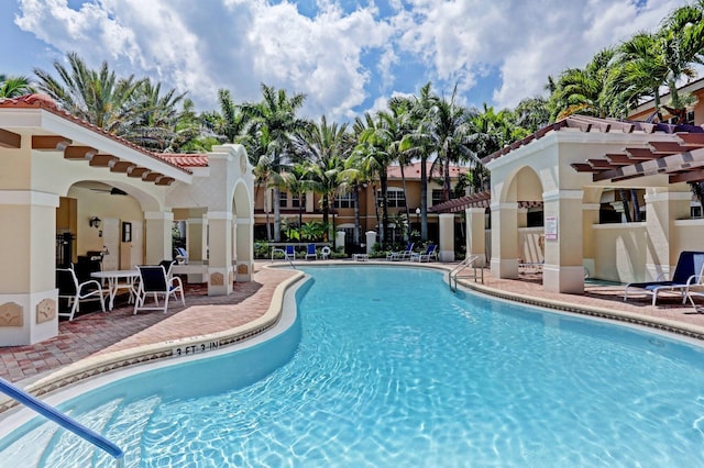 community pool featuring a patio area