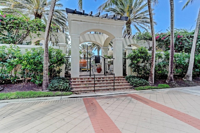 property entrance featuring a gate and fence