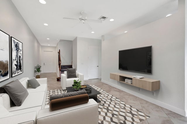 living area featuring recessed lighting, visible vents, baseboards, and stairs