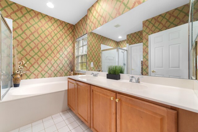 bathroom featuring a sink, visible vents, tile patterned floors, a stall shower, and wallpapered walls