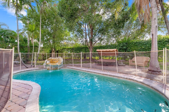 view of pool with a patio area, fence, and a fenced in pool