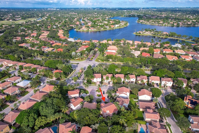 birds eye view of property with a residential view and a water view