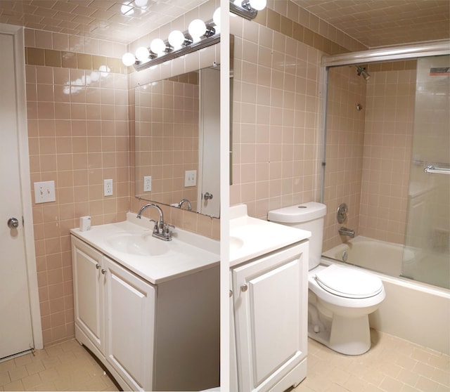 full bath featuring bath / shower combo with glass door, toilet, tile patterned floors, vanity, and tile walls