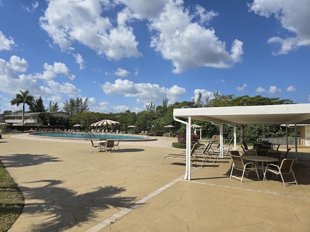 community pool featuring a patio area