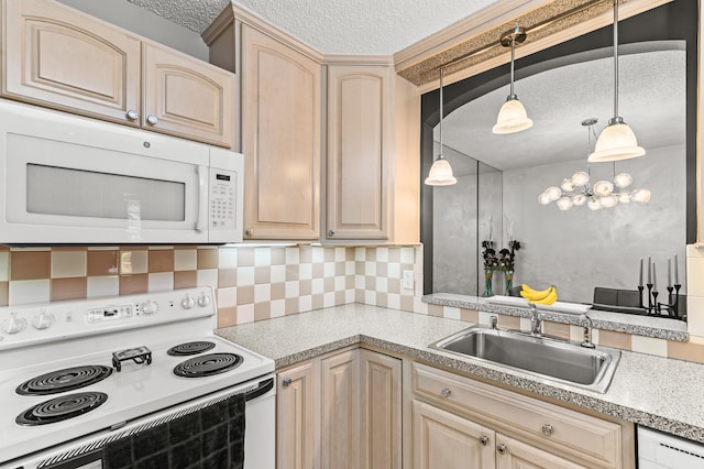 kitchen featuring white appliances, a textured ceiling, decorative backsplash, and a sink