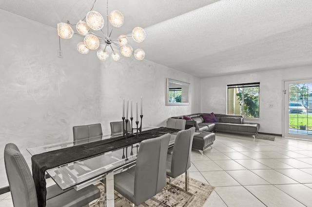 dining room featuring light tile patterned flooring, a textured ceiling, and an inviting chandelier