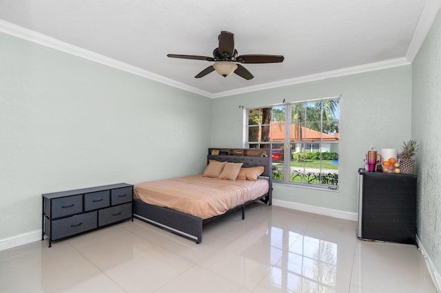 bedroom featuring light tile patterned floors, a ceiling fan, baseboards, and crown molding