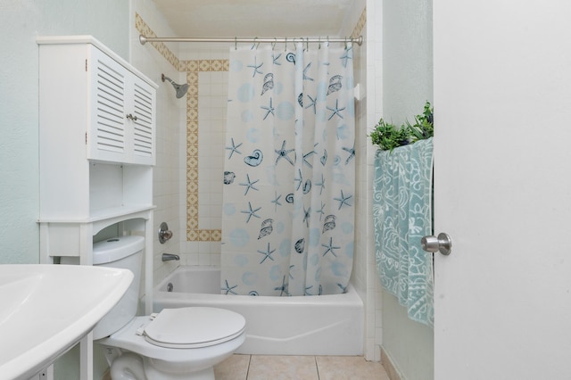 bathroom featuring shower / tub combo, toilet, and tile patterned floors