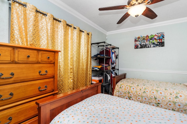 bedroom with ornamental molding and a ceiling fan