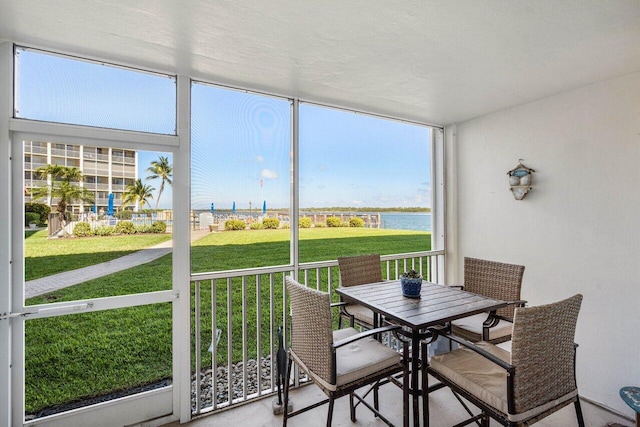 sunroom with a water view