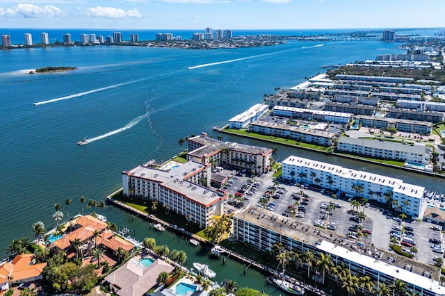 bird's eye view featuring a water view and a city view