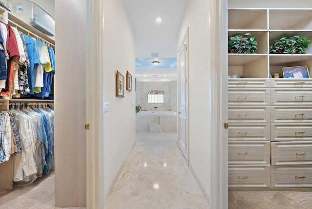 hallway featuring recessed lighting and marble finish floor