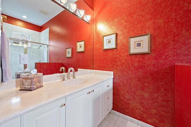 full bath with tile patterned flooring, vanity, visible vents, and a shower stall