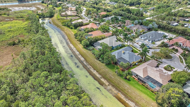 aerial view with a residential view and a water view