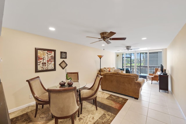 dining room featuring light tile patterned floors, baseboards, and recessed lighting