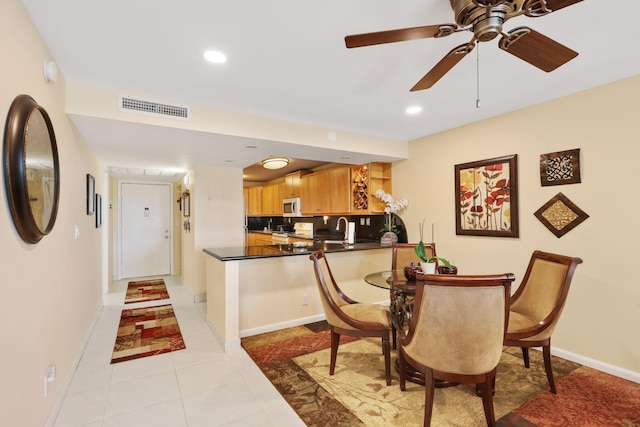 dining room featuring light tile patterned floors, recessed lighting, visible vents, and baseboards