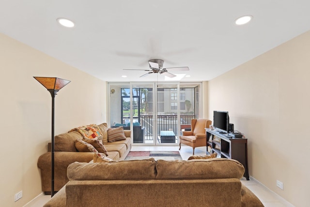 living area with baseboards, recessed lighting, a ceiling fan, and floor to ceiling windows