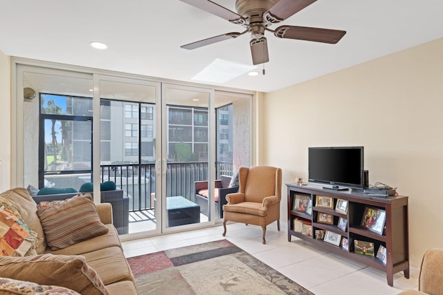 living area with tile patterned flooring, floor to ceiling windows, a ceiling fan, and recessed lighting