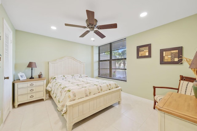 bedroom with light tile patterned floors, a ceiling fan, and recessed lighting