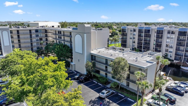 view of property featuring uncovered parking