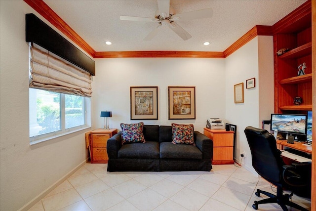 office space with a textured ceiling, crown molding, baseboards, and ceiling fan