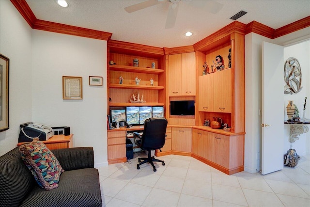 office with visible vents, built in study area, ceiling fan, and ornamental molding