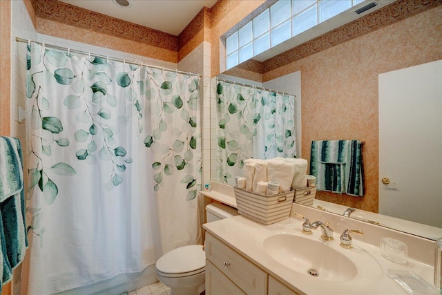 full bath featuring toilet, a shower with curtain, vanity, and visible vents