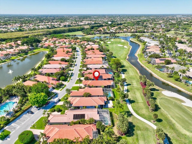 bird's eye view with a residential view, a water view, and view of golf course