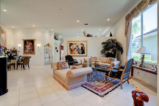 living room with light tile patterned flooring and recessed lighting