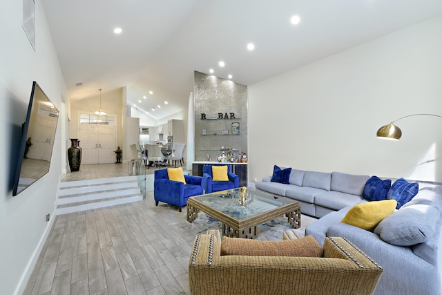 living room with recessed lighting, visible vents, light wood-style floors, high vaulted ceiling, and baseboards