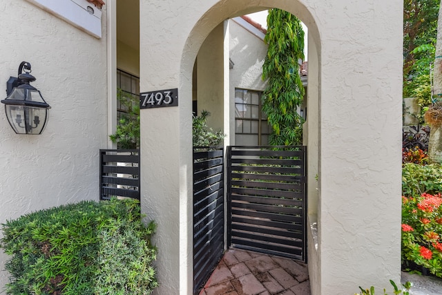 doorway to property with stucco siding