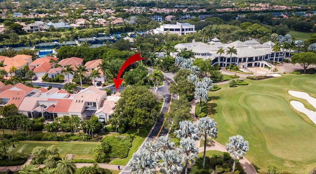 drone / aerial view featuring golf course view and a residential view