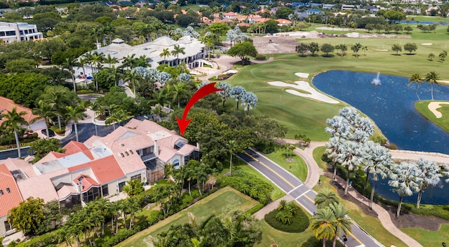 bird's eye view featuring a water view, a residential view, and golf course view