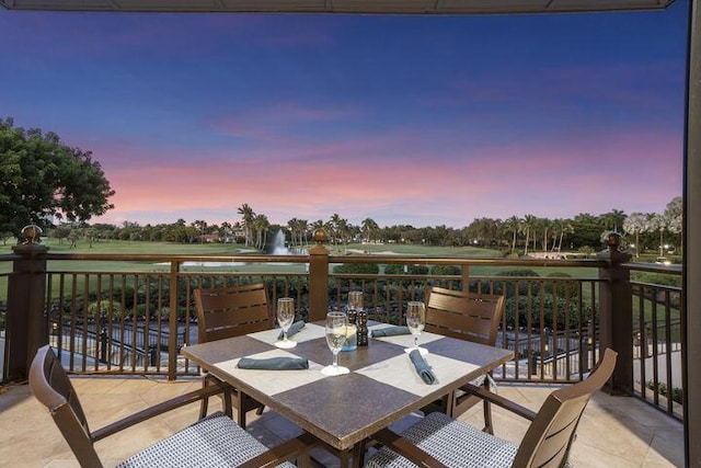 patio terrace at dusk featuring outdoor dining area