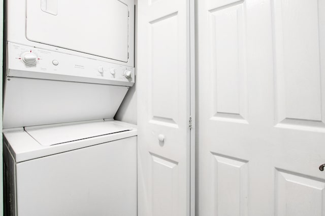 washroom with laundry area and stacked washer and clothes dryer