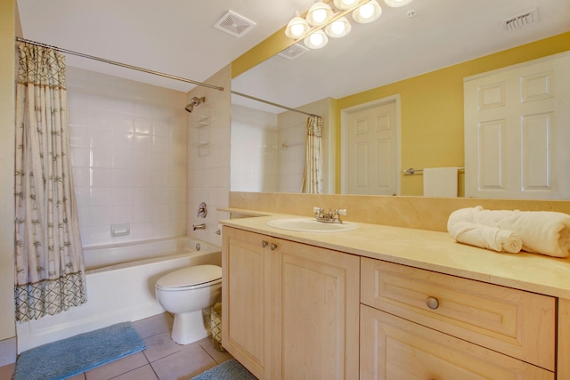 bathroom featuring toilet, vanity, visible vents, and tile patterned floors