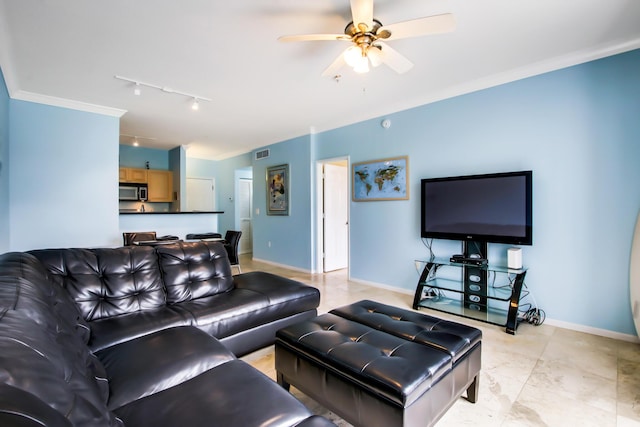 living area with visible vents, ornamental molding, ceiling fan, track lighting, and baseboards